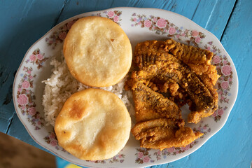 fried fish, rice and arepa 