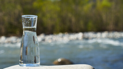 Glass flask with clean drinking water.