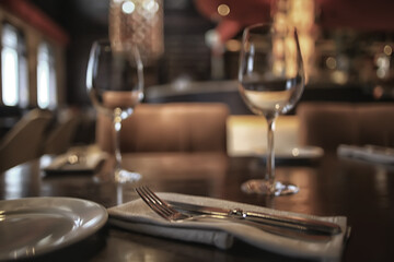 fork and knife serving in the interior of the restaurant / table in a cafe, food industry catering, menu
