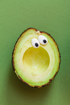 Naklejki funny avocado on the green background