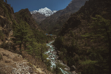 Obraz premium Everest base camp trekking. high mountains in Nepal. blue sky. high altitude landscape. High quality mountain river.