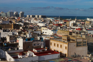 Fototapeta premium Top view of the rooftops of Casablanca and the Atlantic ocean.