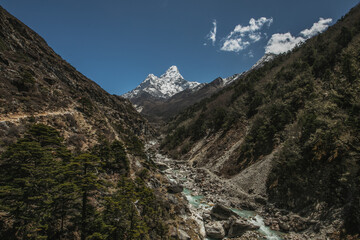 Obraz premium Everest base camp trekking. high mountains in Nepal. blue sky. high altitude landscape. High quality mountain river.
