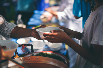 Volunteers Share Food to the Poor to Relieve Hunger : Charity food concept