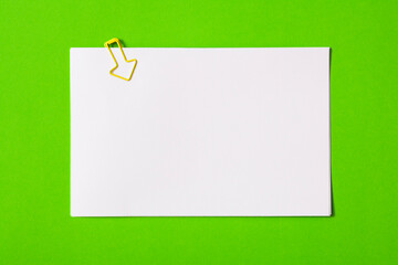 white sheet of paper for notes and paper clip
