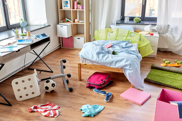 mess, disorder and interior concept - view of messy home kid's room with scattered stuff