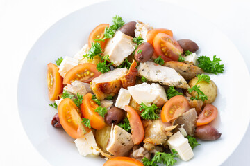 Grilled chicken salad with olives, feta cheese and tomatoes