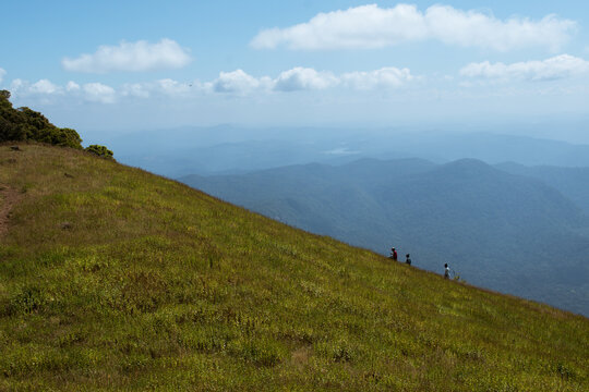 Hiking in the mountains. Tourist at the kodachadri hills climbing it. 