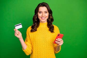 Portrait of positive cheerful girl use smart phone enjoy easy online payment with debit card wear...