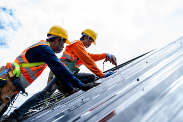 Close up photo of Professional and qualified roofer in protective uniform wear use electric drill...