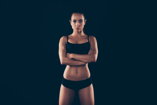 Portrait of her she nice-looking attractive adorable sportive strong lady perfection form figure folded arms physical energy life style isolated over black background
