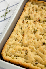 Home-baked Rosemary Garlic Focaccia Bread, side view. Close-up.