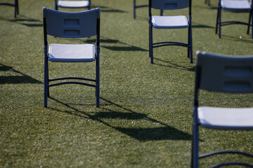 Chairs apart one from another to maintain the social distance during the Covid-19 outbreak at an...