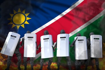 Namibia protest stopping concept, police officers in heavy smoke and fire protecting order against revolt - military 3D Illustration on flag background