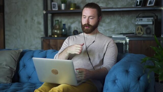 man psychologist distance teacher online tutor wear headphone conferencing on laptop Spbd. gesturing. communicate with student by webcam. video call chat explain course e-learning education concept
