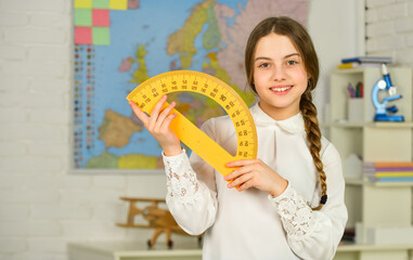 mired in geometry. School girl hold protractor rule. Instrument of Measurement. different school...