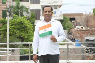 Proud Middle age man  hold indian flag outdoor, republic day or independence day, 15 august, 26...