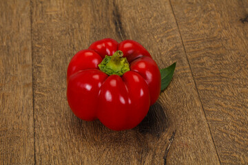 Ripe Red bell pepper over wooden