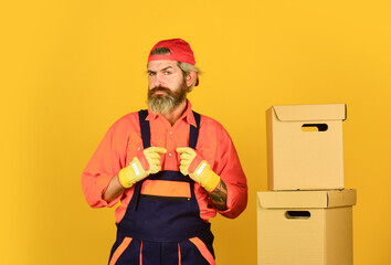 Future profession. Moving house day. think outside the box. express delivery concept. Man worker in...