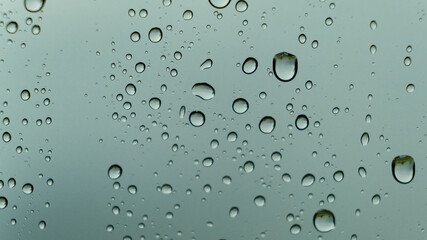 Drops of water on the glass. Macro shooting. Texture. No people.