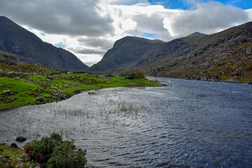 River flowing through a narrow mountain pass Gap of Dunloe in County Kerry, Ireland.