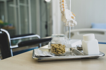Medicine pill on table in doctor working room at hospital , Health care and medical concept wiht copy space