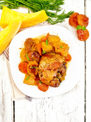 Chicken roast with pumpkin and dried apricots on board top