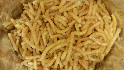 close up of a bowl of Indian snacks 