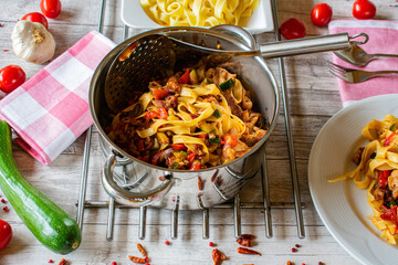 Pasta with meat and vegetables in a cooking pot - ready to eat
