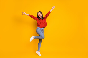 Full size photo of enthusiastic candid girl enjoy rejoice raise hands wear good look outfit shoes isolated over shine color background