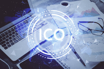 Double exposure of blockchain and crypto economy theme hologram and table with computer background. Concept of bitcoin cryptocurrency.