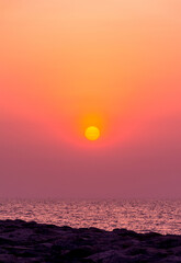 Sunset sky with sailing boat, golden hour click from Palm jumeira, Dubai, Dramatic sunset photography, travel concept image