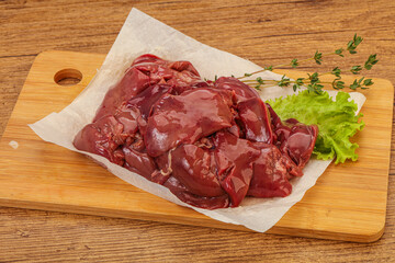 Raw chicken liver over board