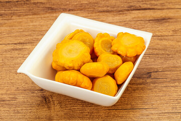 Marinated yellow patisson in the bowl