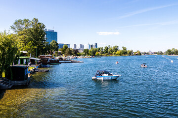 View on Old Danube River, ger. Alte Donau, with Boats, Landscape and Buildings in Vienna, Austria, Europe