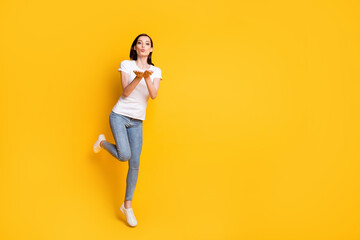 Fototapeta na wymiar Full length body size view of her she pretty thin girl jumping sending you air kiss having fun romance affection amour cupid date isolated bright vivid shine vibrant yellow color background