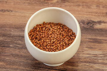 Raw buсkwheat cereal in the bowl