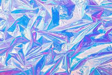 Blurred abstract Modern pastel colored holographic background in 80s style. Crumpled iridescent...