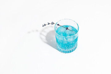 
Delicious cocktail with lavender in a glass on a white background.