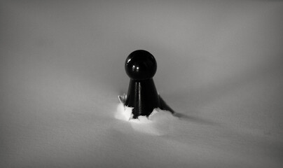Black pawn breaking through white ground