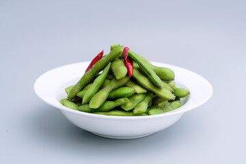 A traditional Chinese delicacy in solid color, boiled soybeans in brine. Chinese traditional food boiled soybean