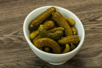 Pickled gherkin in the bowl
