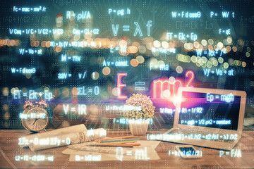 Desktop computer background and formula hologram writing. Double exposure. Education concept.