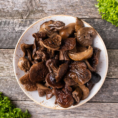 Boild white mushrooms on a plate. Top view.