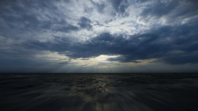 Drone flight over ocean against stormy clouds
