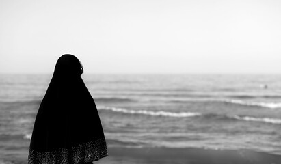 woman with black veil on her head waiting with dramatic black an