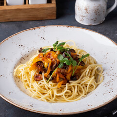 Spaghetti with vegetables on a plate.