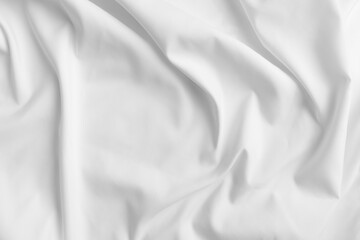 Abstract white fabric texture background. Cloth soft wave. Creases of satin, silk, and cotton.	