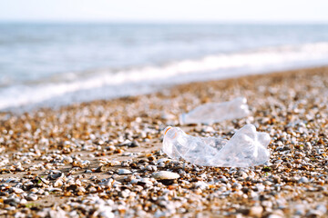 Empty plastic bottles on the beach,. Problem of global plastic pollution of the Earth.