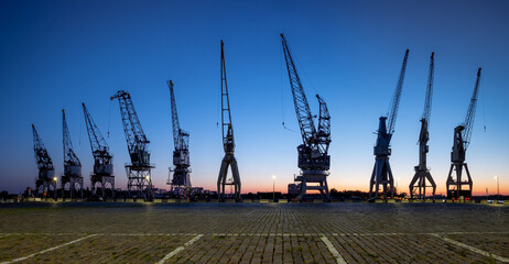 Old harbor cranes in the city of Antwerp.